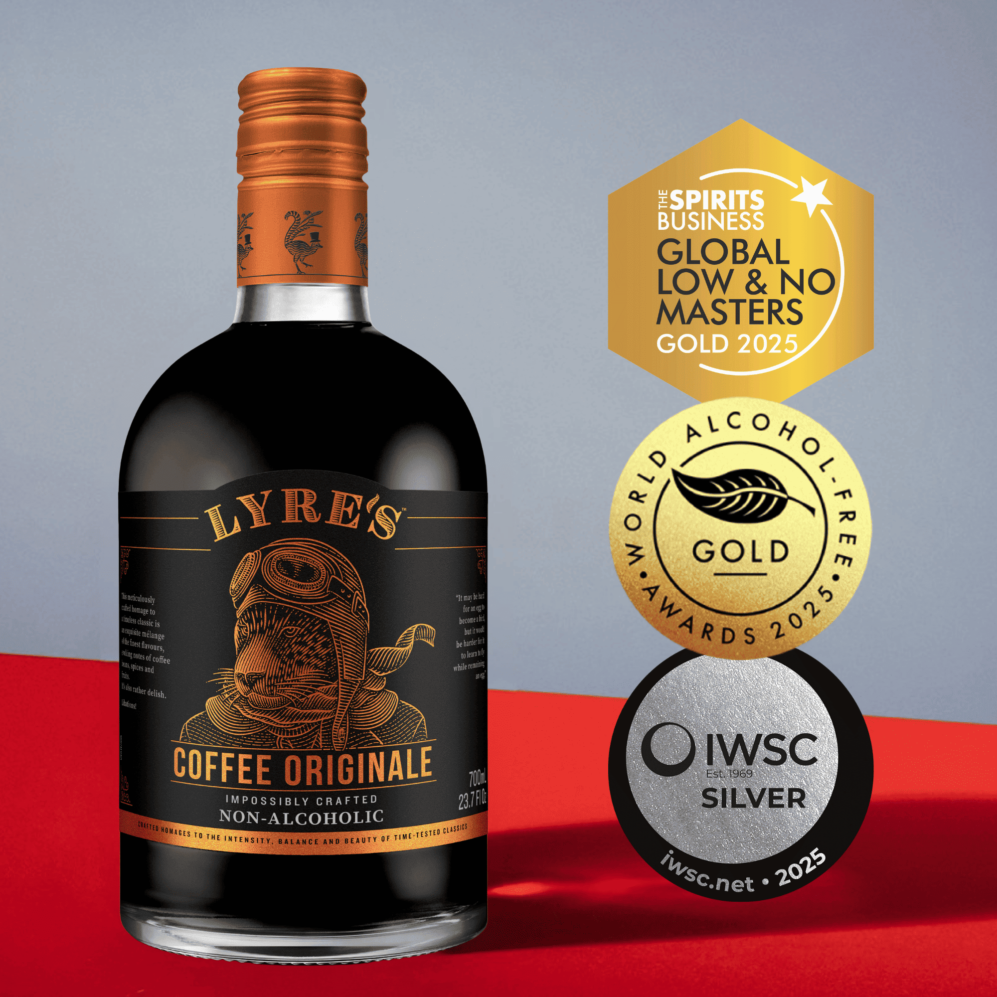 Bottle of Lyre's Coffee Originale non-alcoholic coffee liqueur with awards on a red and gray background